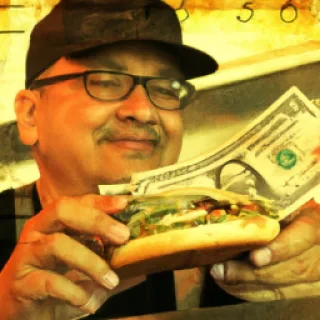 Happy burger vendor taking cash